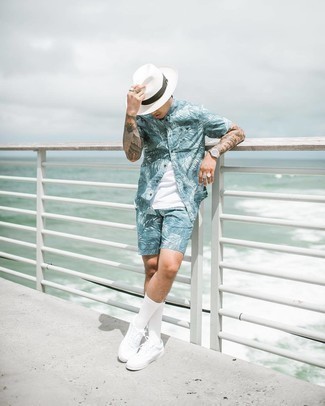 Light Blue Print Shorts Outfits For Men: This combination of a light blue print short sleeve shirt and light blue print shorts is effortless, seriously stylish and very easy to copy. Now all you need is a pair of white canvas low top sneakers to complete this ensemble.