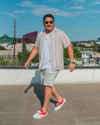 Red and White Canvas Low Top Sneakers Outfits For Men: If you prefer a more relaxed approach to style, why not try pairing a light blue print short sleeve shirt with light blue ripped denim shorts? Make your outfit a bit dressier by finishing with red and white canvas low top sneakers.