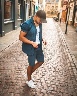 Grey Canvas Watch Outfits For Men: Choose a navy vertical striped short sleeve shirt and a grey canvas watch, if you want to dress for comfort without looking like you don't care to look stylish. Introduce a pair of white athletic shoes to the equation to instantly spice up the look.