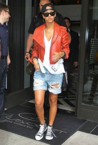 Rihanna wearing Grey High Top Sneakers, Light Blue Ripped Denim Shorts, White Tank, Orange Leather Biker Jacket