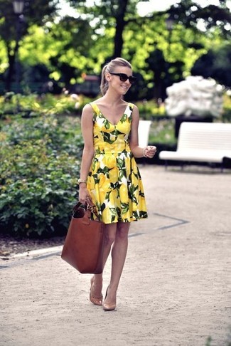 Master casual look in a yellow floral skater dress. Take this look in a more elegant direction by slipping into a pair of tan leather pumps.
