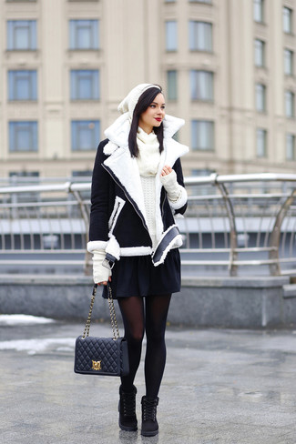 Women's Black Suede Lace-up Flat Boots, Black Skater Skirt, White Crew-neck Sweater, Black and White Shearling Jacket