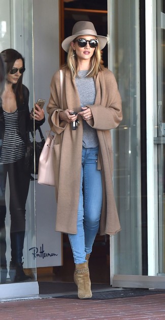 Rosie Huntington-Whiteley wearing Olive Suede Ankle Boots, Light Blue Skinny Jeans, Grey Crew-neck Sweater, Camel Knit Coat
