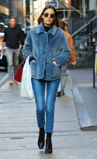 Alexa Chung wearing Black Leather Lace-up Ankle Boots, Blue Skinny Jeans, Navy Crew-neck Sweater, Blue Fur Jacket