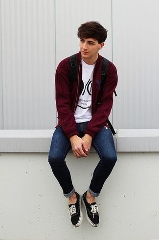 Men's Black and White Canvas Low Top Sneakers, Navy Ripped Skinny Jeans, White and Black Print Crew-neck T-shirt, Burgundy Bomber Jacket