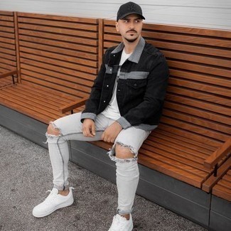 Men's White Canvas Low Top Sneakers, Grey Ripped Skinny Jeans, White and Black Print Crew-neck T-shirt, Black Denim Jacket