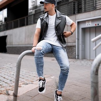 Men's Black and White Canvas Low Top Sneakers, Light Blue Ripped Skinny Jeans, White Crew-neck T-shirt, Black Leather Gilet