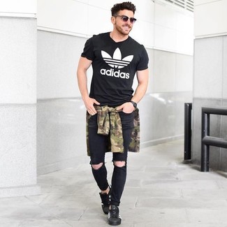 Men's Black Leather Low Top Sneakers, Black Ripped Skinny Jeans, Black and White Print Crew-neck T-shirt, Olive Camouflage Long Sleeve Shirt