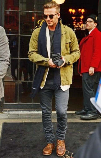 David Beckham wearing Brown Leather Derby Shoes, Grey Skinny Jeans, Olive Crew-neck T-shirt, Olive Military Jacket