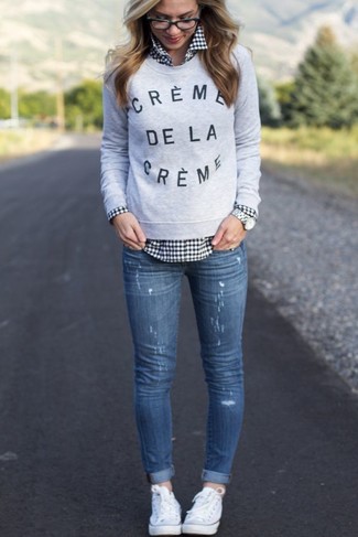 Women's White Low Top Sneakers, Blue Ripped Skinny Jeans, Black and White Gingham Dress Shirt, Grey Print Crew-neck Sweater