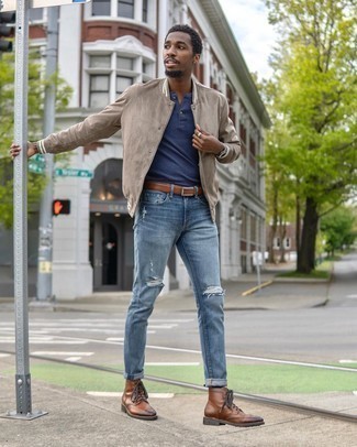 Men's Brown Leather Brogue Boots, Blue Ripped Skinny Jeans, Navy Henley Shirt, Beige Varsity Jacket