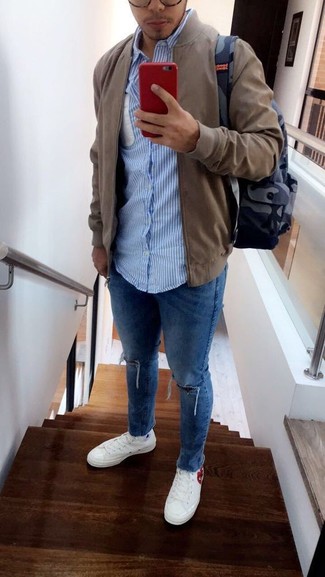 Men's White Canvas Low Top Sneakers, Blue Ripped Skinny Jeans, Light Blue Vertical Striped Long Sleeve Shirt, Olive Bomber Jacket