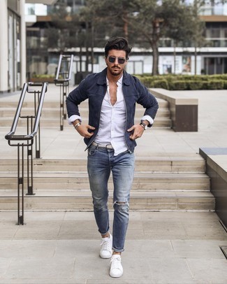 Men's White Canvas Low Top Sneakers, Blue Ripped Skinny Jeans, White Linen Long Sleeve Shirt, Navy Suede Harrington Jacket