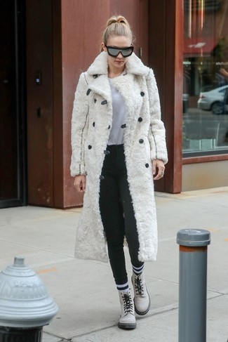 Gigi Hadid wearing White Leather Lace-up Flat Boots, Charcoal Wool Skinny Pants, White Crew-neck T-shirt, White Fur Coat