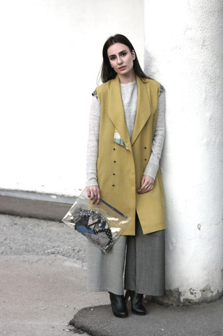 Grey Wide Leg Pants Outfits: Such staples as a mustard sleeveless coat and grey wide leg pants are the perfect way to inject extra polish into your day-to-day off-duty rotation. Enter a pair of black leather ankle boots into the equation and the whole look will come together quite nicely.