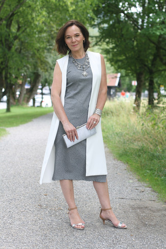 Grey Midi Dress Outfits: If you prefer casual getups, why not try pairing a grey midi dress with a white sleeveless coat? If in doubt as to the footwear, stick to a pair of silver leather heeled sandals.