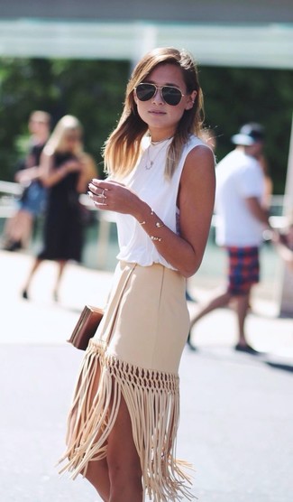 Beige Fringe Midi Skirt Outfits: This combo of a white sleeveless top and a beige fringe midi skirt is super chic and provides a laid-back and cool look.