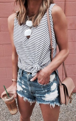 Blue Ripped Denim Shorts Outfits For Women: This relaxed casual pairing of a white and navy horizontal striped sleeveless top and blue ripped denim shorts can only be described as outrageously chic.