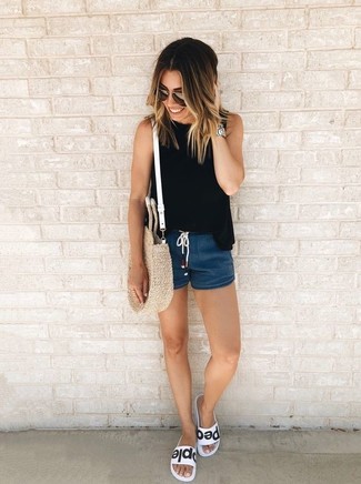 Navy Shorts Outfits For Women: For a cool and casual ensemble, rock a black sleeveless top with navy shorts — these two items fit perfectly well together. For times when this ensemble is too much, tone it down by finishing off with a pair of white and black leather flat sandals.