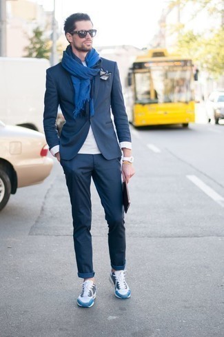 Blue Scarf Outfits For Men: When the setting allows relaxed styling, you can easily rely on a navy suit and a blue scarf. Finishing off with a pair of white and blue athletic shoes is the most effective way to inject a dose of stylish nonchalance into your outfit.