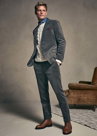 Grey Suit with Denim Shirt Outfits: Marrying a grey suit and a denim shirt is a guaranteed way to inject polish into your day-to-day styling arsenal. For a more laid-back vibe, why not throw in a pair of brown leather casual boots?