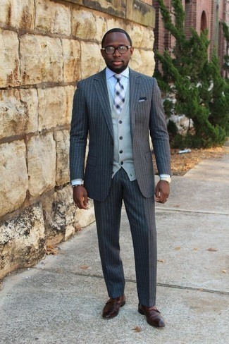 Navy Plaid Tie Outfits For Men: Loving how this pairing of a charcoal vertical striped suit and a navy plaid tie immediately makes any man look sophisticated and stylish. A trendy pair of brown leather double monks is a simple way to add a dose of stylish effortlessness to your ensemble.