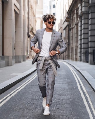 Grey Check Suit Outfits: When the occasion calls for a refined yet killer outfit, you can easily wear a grey check suit and a grey crew-neck sweater. A pair of white canvas low top sneakers will bring a carefree touch to this outfit.