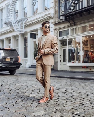 Tobacco Leather Derby Shoes Outfits: You're looking at the definitive proof that a tan suit and a beige crew-neck sweater are amazing when married together in a refined look for a modern man. A pair of tobacco leather derby shoes will pull your full outfit together.