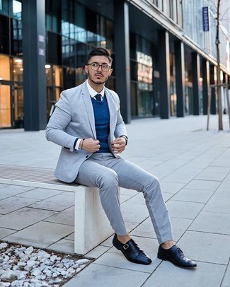Navy Tie Outfits For Men: You're looking at the irrefutable proof that a light blue suit and a navy tie are amazing when paired together in a refined look for today's man. Switch up your ensemble with a more laid-back kind of shoes, such as these navy leather monks.
