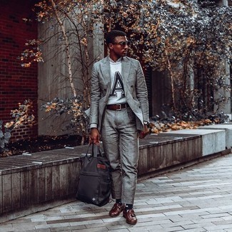 Dark Brown Leather Tassel Loafers Outfits: This ensemble with a grey plaid suit and a grey embroidered crew-neck sweater isn't a hard one to score and easy to change according to circumstances. Tone down the casualness of your outfit with a pair of dark brown leather tassel loafers.