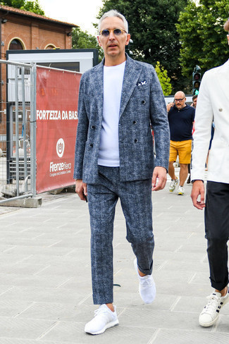 Blue Wool Suit Outfits: This combo of a blue wool suit and a white crew-neck t-shirt epitomizes masculine elegance and class. A trendy pair of white athletic shoes is an easy way to upgrade this look.