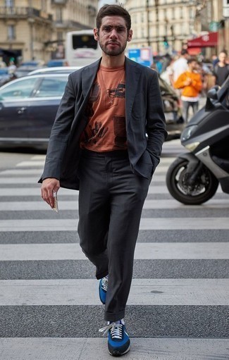 Blue Athletic Shoes Outfits For Men: This outfit with a charcoal suit and an orange print crew-neck t-shirt isn't hard to create and easy to adapt throughout the day. Feeling creative? Play down your look by finishing off with a pair of blue athletic shoes.