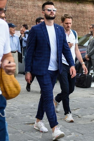 Navy Plaid Suit Outfits: This semi-casual combo of a navy plaid suit and a white crew-neck t-shirt is extremely easy to put together without a second thought, helping you look sharp and prepared for anything without spending too much time combing through your wardrobe. Introduce a more relaxed finish to by sporting white athletic shoes.