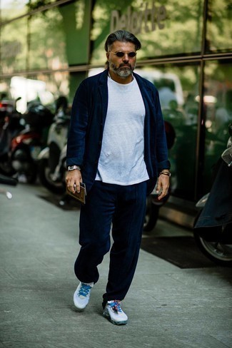 White Athletic Shoes Outfits For Men: For a winning smart casual option, you can't go wrong with this combination of a navy corduroy suit and a white crew-neck t-shirt. Give a more informal twist to your outfit by rocking white athletic shoes.