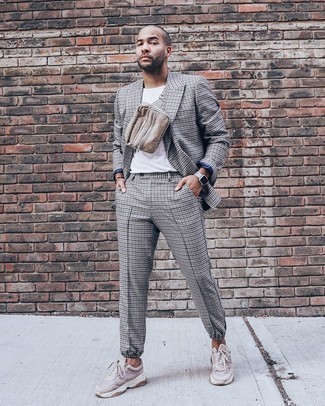 Grey Suit Casual Outfits: Teaming a grey suit and a white crew-neck t-shirt is a fail-safe way to inject your daily fashion mix with some casual refinement. Feeling experimental today? Spice up this outfit by slipping into a pair of beige athletic shoes.