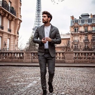 Charcoal Plaid Suit Outfits: A charcoal plaid suit and a white crew-neck t-shirt are absolute must-haves if you're figuring out a polished wardrobe that matches up to the highest fashion standards. If in doubt about the footwear, stick to black leather casual boots.