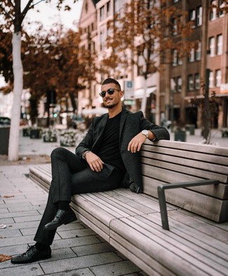 Grey Wool Suit Warm Weather Outfits: For a look that's worthy of a modern stylish guy and effortlessly neat, wear a grey wool suit and a black crew-neck t-shirt. You could take the classic route on the shoe front by rounding off with a pair of black leather derby shoes.