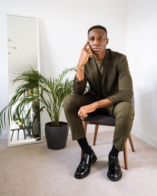 Olive Suit Outfits: Rock an olive suit with an olive crew-neck t-shirt for a clean classy menswear style. Demonstrate your refined side by finishing off with a pair of black leather derby shoes.