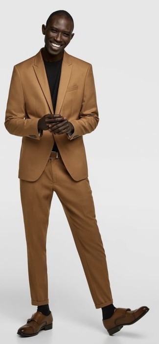 Dark Brown Suit Outfits: One of the coolest ways for a man to style such a practical item as a dark brown suit is to team it with a black crew-neck t-shirt. Hesitant about how to finish your look? Finish off with brown leather double monks to step up the classy factor.