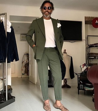 Olive Suit Outfits: For a casually neat outfit, pair an olive suit with a white crew-neck t-shirt — these pieces go really cool together. Tap into some David Beckham stylishness and spruce up your outfit with tan print leather loafers.