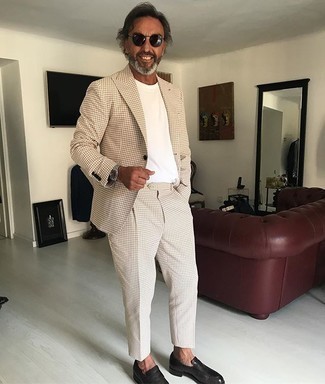 Beige Suit with Loafers Outfits After 50: A beige suit and a white crew-neck t-shirt make for the perfect base for a variety of looks. To bring a bit of flair to your ensemble, throw a pair of loafers into the mix. Overall, a perfect example of over-50 style.
