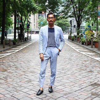 Light Blue Suit Outfits: This combo of a light blue suit and a navy and white horizontal striped crew-neck t-shirt is truly dapper and creates instant appeal. If you wish to immediately dress up your look with a pair of shoes, why not add dark green leather loafers to the equation?