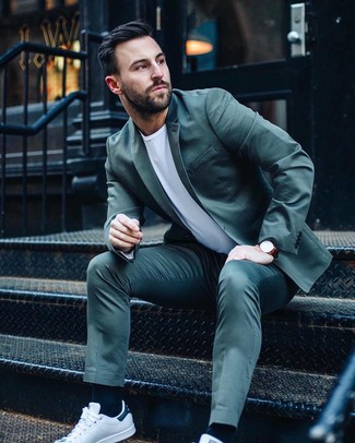 Dark Green Suit Outfits: For a look that's street-style-worthy and casually refined, go for a dark green suit and a white crew-neck t-shirt. Put a dressed-down spin on an otherwise dressy look by finishing with white leather low top sneakers.