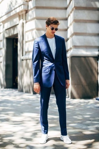 Blue Vertical Striped Suit Outfits: As you can see, looking stylish doesn't take that much effort. Wear a blue vertical striped suit with a white crew-neck t-shirt and you'll look incredibly stylish. Balance your look with more relaxed shoes, like these white canvas low top sneakers.