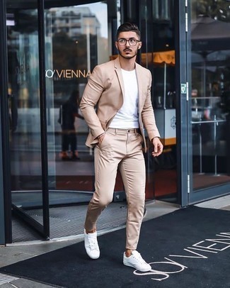 Beige Suit Smart Casual Outfits: Try teaming a beige suit with a white crew-neck t-shirt to achieve new levels in menswear styling. You could follow a more casual route on the shoe front by slipping into a pair of white canvas low top sneakers.