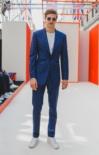 Navy Check Suit Outfits: If you take your style seriously, go for a casually classy look in a navy check suit and a white crew-neck t-shirt. Give a dressed-down twist to an otherwise all-too-safe ensemble by sporting white leather low top sneakers.