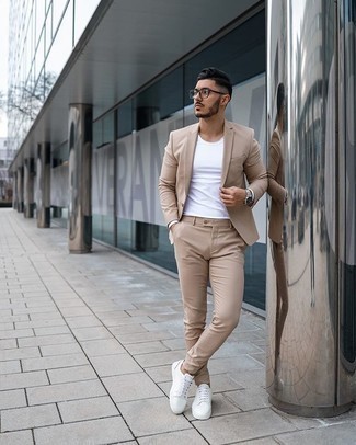 Tan Suit with White Canvas Low Top Sneakers Smart Casual Outfits In Their 30s: A tan suit and a white crew-neck t-shirt matched together are a perfect match. Feeling adventerous? Break up your look with a pair of white canvas low top sneakers. Dressed like this, any gent in his 30s is guaranteed to put most of his peers to shame.