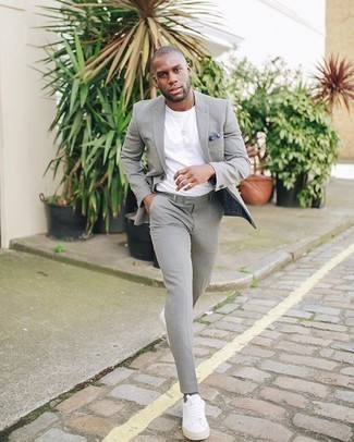 grey suit and white sneakers