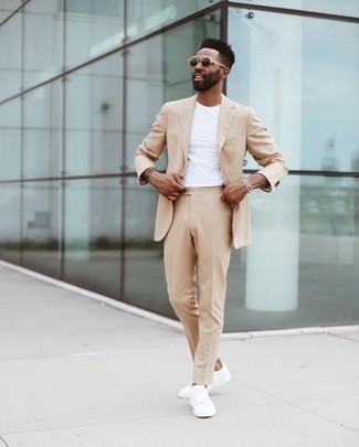 Gold Bracelet Outfits For Men: A tan suit and a gold bracelet are a great combo to have in your off-duty rotation. Rock a pair of white canvas low top sneakers and you're all done and looking smashing.