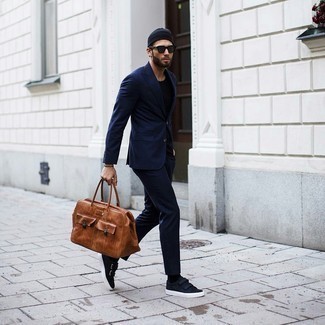 Tobacco Leather Duffle Bag Outfits For Men: For something more on the relaxed end, go for a navy suit and a tobacco leather duffle bag. A pair of navy canvas low top sneakers looks great here.
